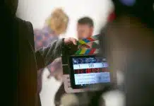 person holding clapperboard