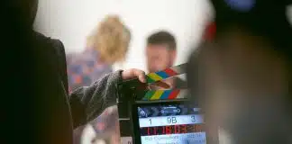 person holding clapperboard